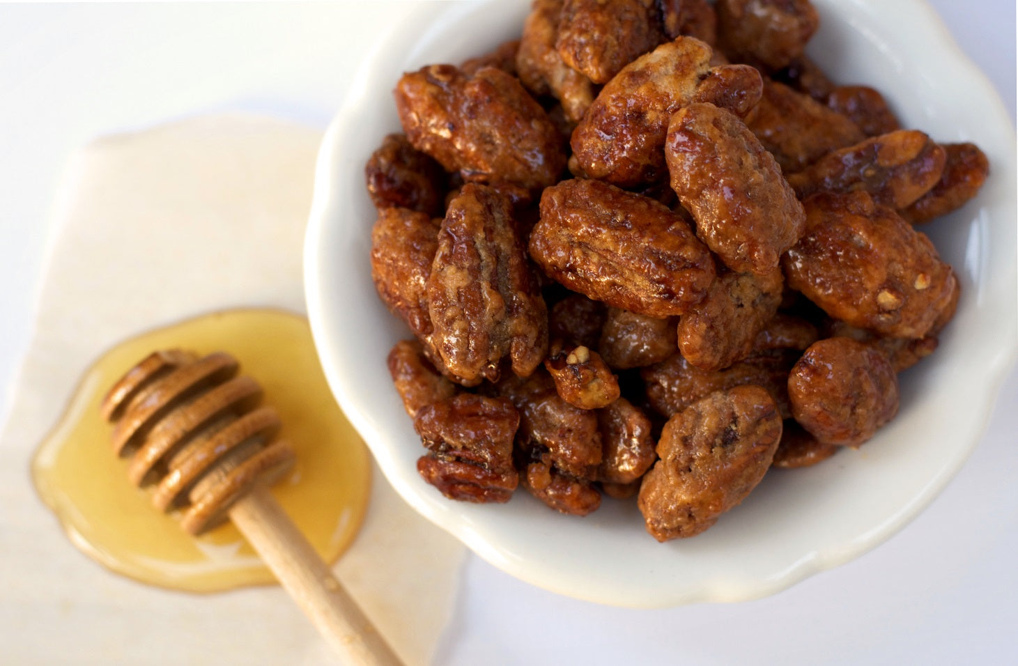 Sweet honey roasted candied pecans for sale. These mouthwatering glazed pecans make for wonderful Texas gifts or enjoy them yourself!