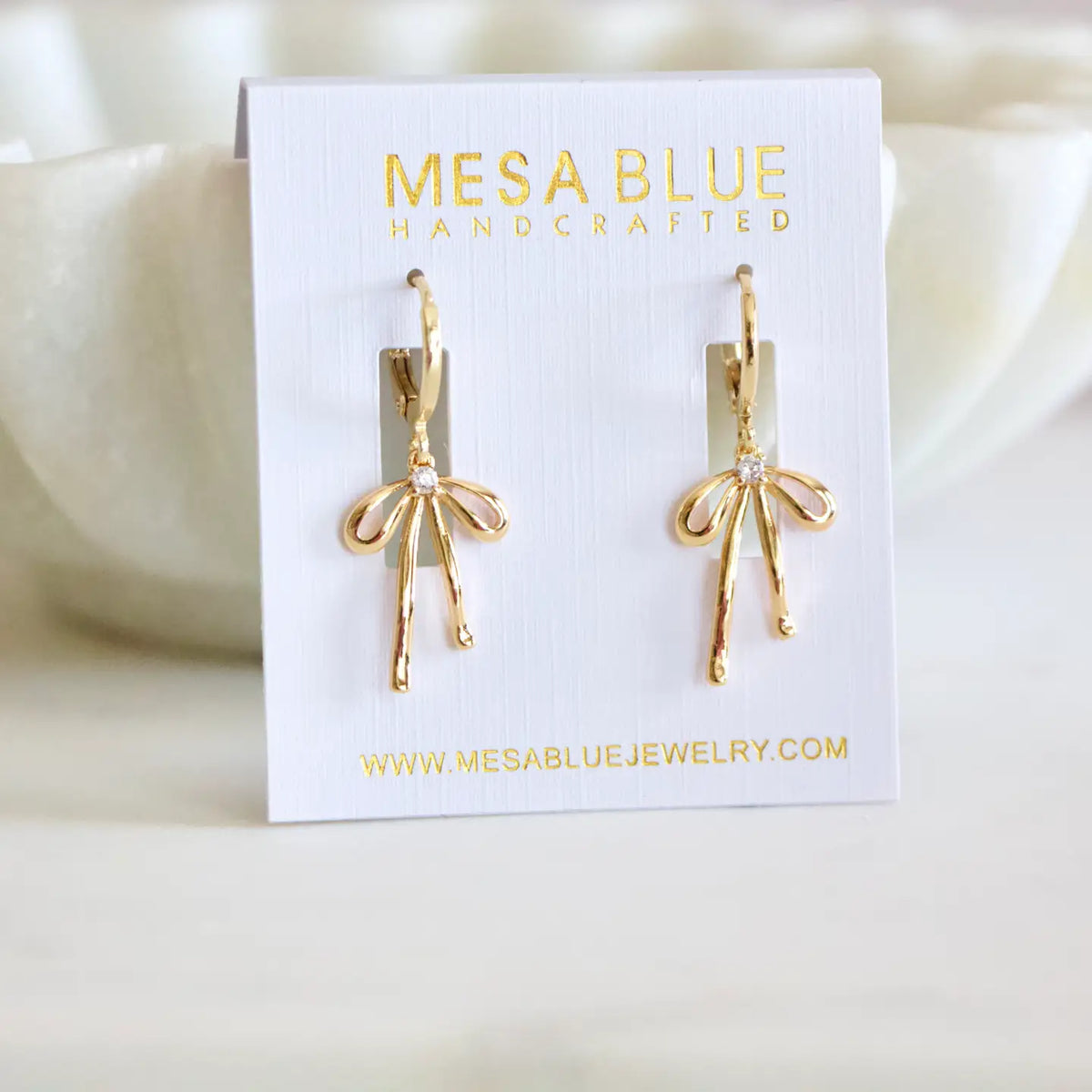 Gold Plated Bow Huggie Earrings by Mesa Blue