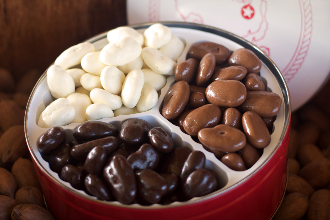 Our Tri-Chocolate Gift Tin includes: Milk Chocolate Pecans, Dark Chocolate Pecans and White Chocolate Pecans